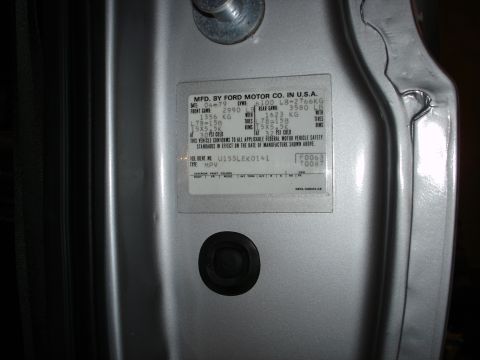 1979 Ford Bronco - Close-up of a vehicle's door jamb VIN plate, indicating a manufacturing date of 04/79.