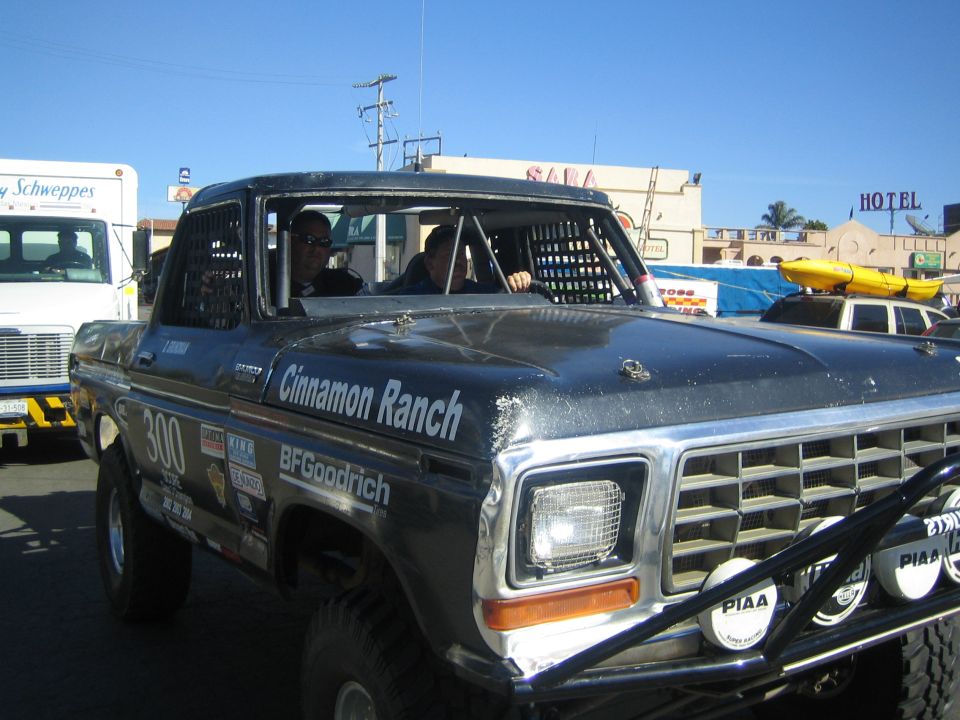 Gray 1970s Ford pickup race truck lettered Cinnamon Ranch and BFGoodrich