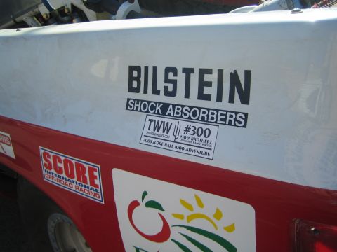 1990 Ford Bronco - Close-up of a race truck body panel showing a Bilstein Shock Absorbers decal alongside SCORE and team #300 stickers.