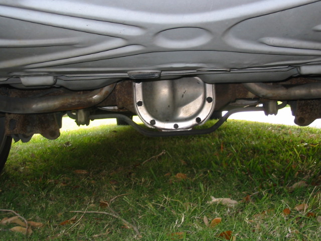 Underside view of a vehicle's rear differential and exhaust system