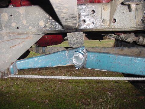 1969 Ford Bronco - Undercarriage view shows suspension parts and a crushed can attached to a blue bar.