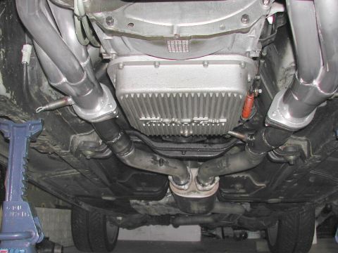1993 Ford Thunderbird - Vehicle's exhaust system and transmission pan are visible from underneath.