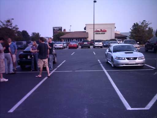 Silver coupe with hood scoop, front view