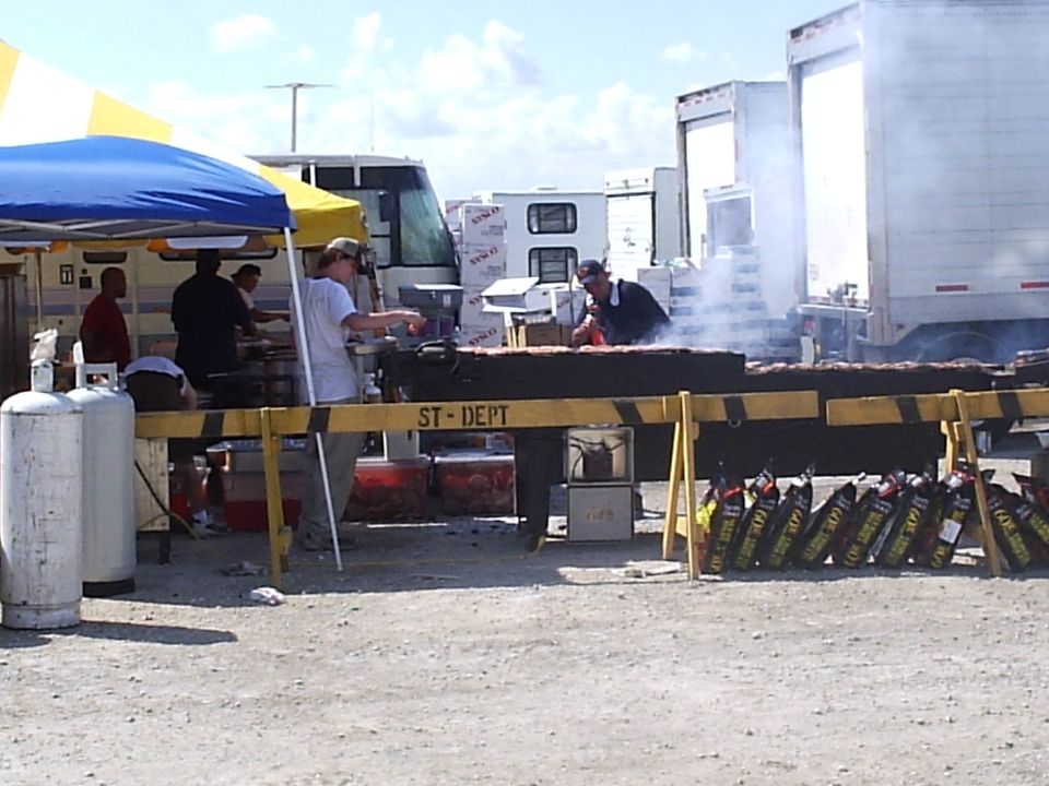 catering company cookin steak on the conveyer grill