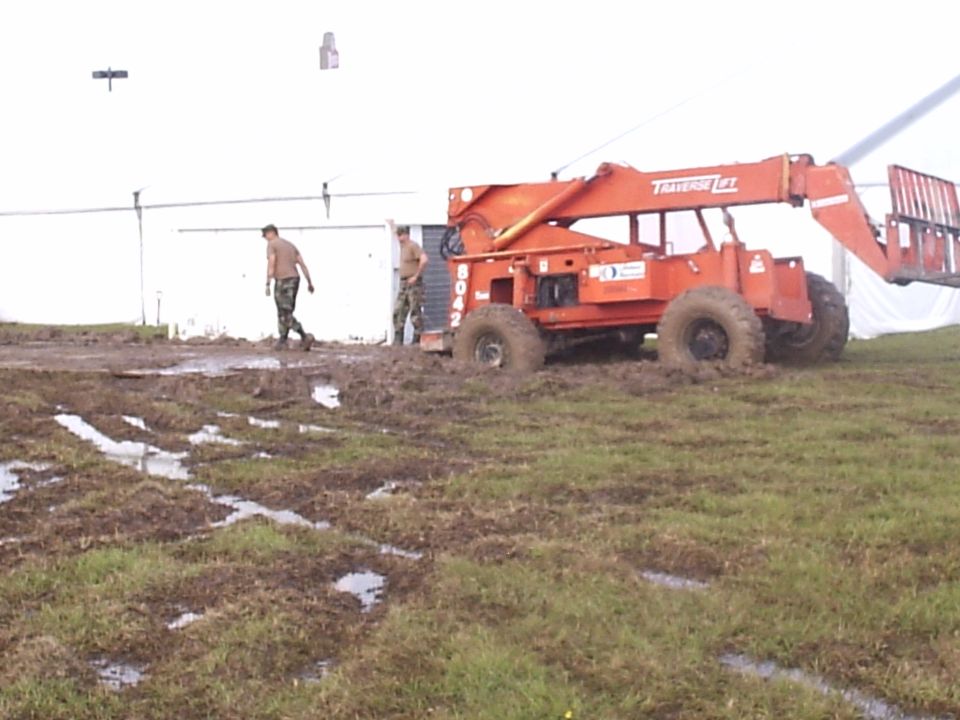 thats me leaning on the ac unit, trying to figure out how to get out my STUCK fork lift. it got hung up on the back counterwieght and the plastic walkway. Dang Louisiana mud!