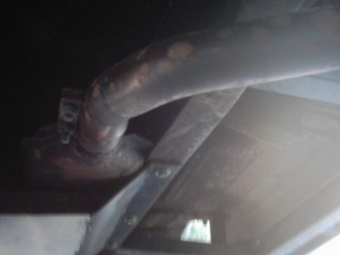 1978 Ford Bronco - Undercarriage view showing exhaust pipe and structural components.