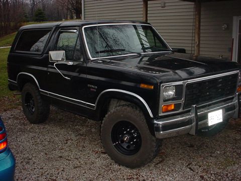 1983 Ford Bronco - Black 1983 Ford Bronco with chrome trim and aftermarket wheels.