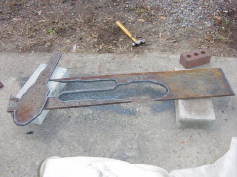 1991 Ford Bronco - New bumper endplates cooling after being cut out of 1/2" plate with the torch. Lots of cleanup still required. These plates will cap off th…