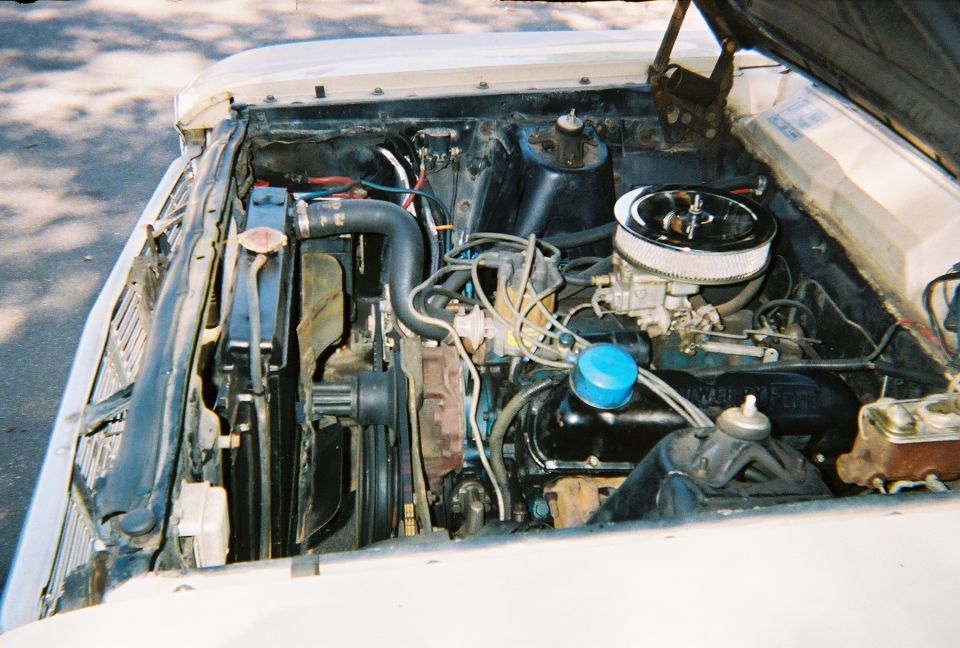 1966 Ford Ranchero engine bay with V8 engine, carburetor, and radiator