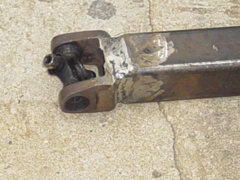 1989 Ford Bronco - Close-up of a driveshaft's U-joint connection, showing evidence of welding and repair.