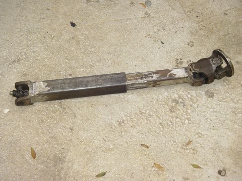 1989 Ford Bronco - This driveshaft part features two universal joints and a telescoping section.