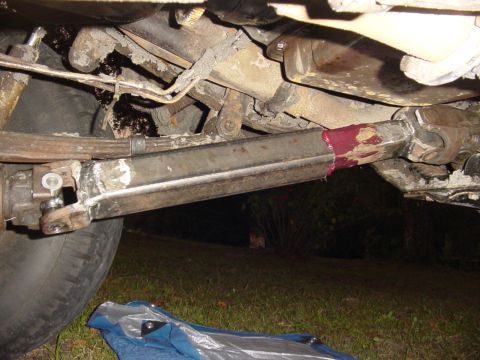 1989 Ford Bronco - Undercarriage view shows a driveshaft with fresh grease applied to a joint.