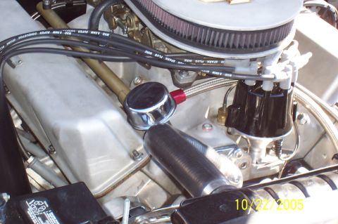 1969 Ford Ranchero - Close-up view of an engine bay, showing various components like the air filter, distributor, and spark plug wires.