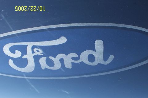 1969 Ford Ranchero - A close-up of a Ford logo on a blue surface, with a date stamp of 10/22/2005 visible in the upper left corner.