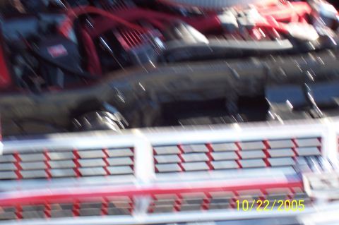 1969 Ford Ranchero - Close-up of a vehicle's engine bay and front grille, with a watermark indicating the photo was taken in 2005.
