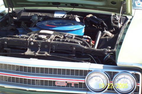 1969 Ford Ranchero - The engine bay of a 1969 Ford Ranchero, a GT badge on its front grille.
