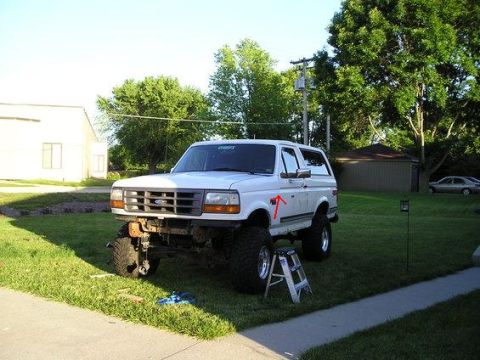 1991 Ford Bronco - This lifted Ford Bronco sits on a grassy lawn, ready for its next adventure.