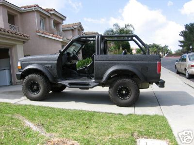 1991 Ford Bronco - This modified 1991 Ford Bronco is shown with its doors removed and a roll cage installed.