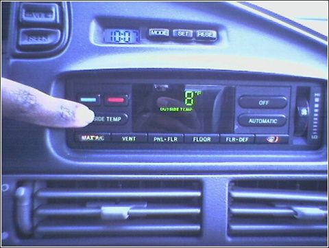 1992 Ford Taurus - Close-up of a car's climate control panel with digital display.