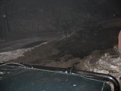 1992 Ford Bronco - The vehicle navigates a dark, snow-covered path, possibly an underground tunnel or cavern.