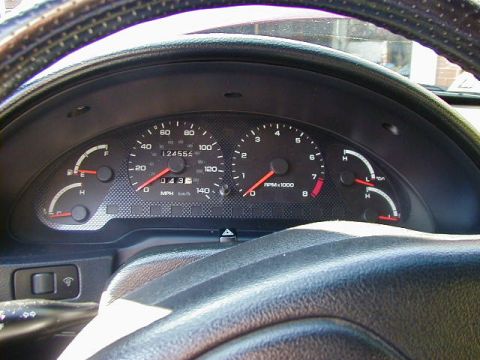 1994 Ford Probe - The interior dashboard of a 1994 Ford Probe displays the odometer reading and current speed.