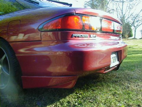 1994 Ford Probe - Rear view of a red 1994 Ford Probe, showing the 'PROBE 2.0' badging and taillight assembly.