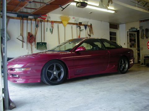 1994 Ford Probe - Maroon 1994 Ford Probe GT parked in a garage with tools on the wall.