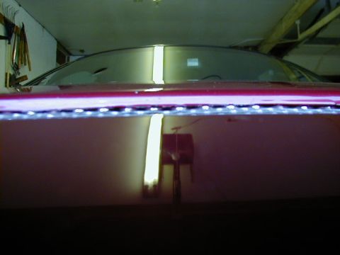 1994 Ford Probe - A close-up view of a car's hood, an aftermarket LED light strip.