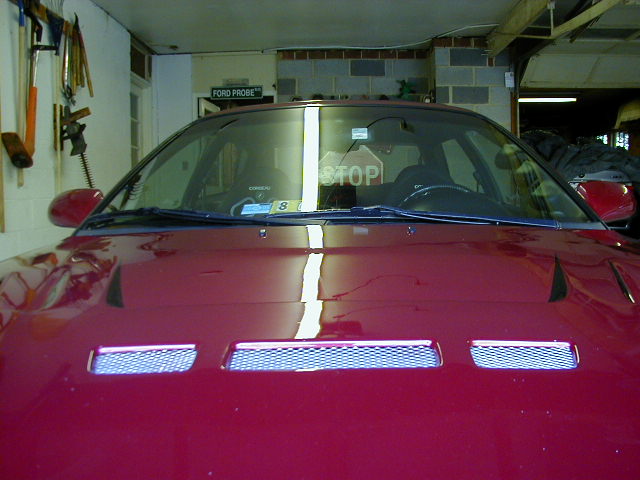 Red 1994 Ford Probe hood with vents, seen from the front