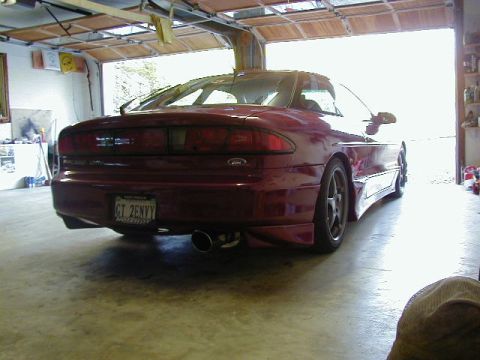 1994 Ford Probe - 1994 Ford Probe GT parked in a garage, rear view. The license plate is visible.
