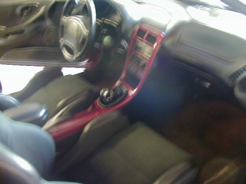 1994 Ford Probe - Interior view of a 1994 Ford Probe, showing the dashboard, center console, and seats.