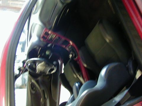 1994 Ford Probe - Interior view of a red car, focusing on the seats and dashboard area.