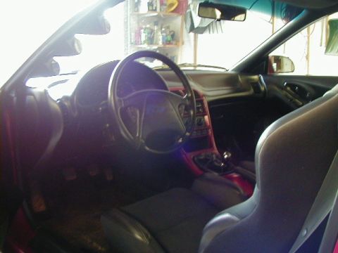 1994 Ford Probe - Interior view of a 1994 Ford Probe, showing the dashboard, steering wheel, and seats.