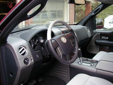 1994 Ford Probe - Interior view of a truck, a gray dashboard, steering wheel, and seats, with a visible gear shifter.