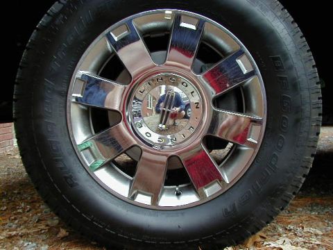 1994 Ford Probe - A close-up view of a chrome Lincoln wheel and tire assembly.