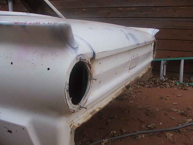 1963 Ford Fairlane rear quarter panel, primer finish, missing taillight assembly