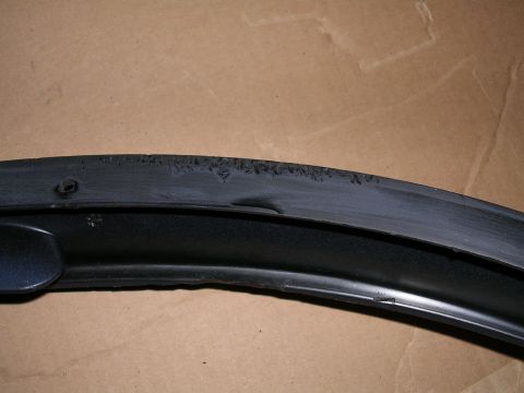 1996 Ford Probe - This is a close-up view of a worn rubber seal, likely from a vehicle component.
