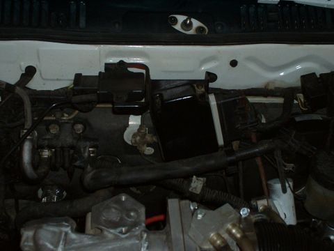 1992 Ford Probe - Close-up view of engine bay components, including hoses and electrical wiring.