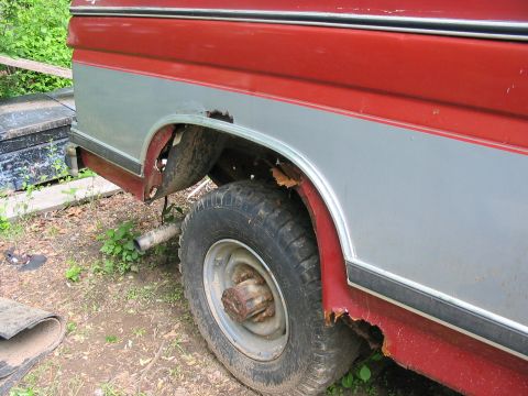 1985 Ford F-350 - This pickup truck shows extensive rust around the rear wheel well and fender, indicating significant wear and tear.
