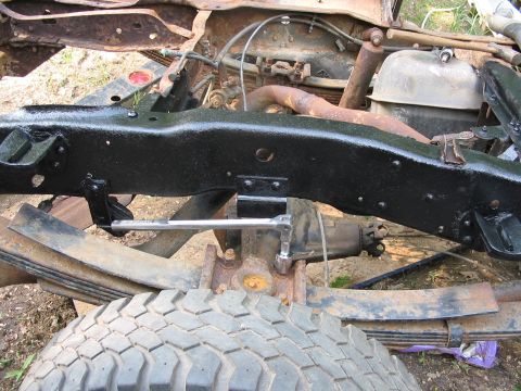 1985 Ford F-350 - Close-up view of the frame and suspension components of a 1985 Ford F-350 truck.
