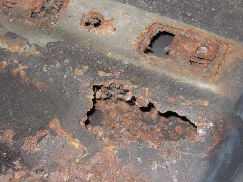 1985 Ford F-350 - Significant rust damage is visible on this vehicle's frame, indicating extensive corrosion.