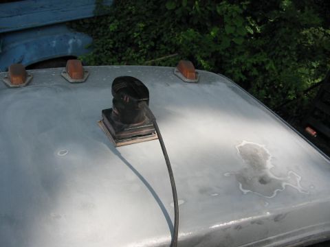 1985 Ford F-350 - A power sander is being used on the roof of a vehicle, with amber clearance lights visible.