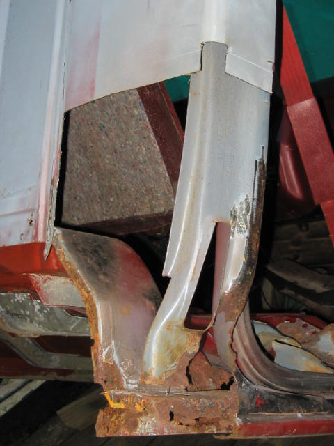 1985 Ford F-350 - Extensive rust damage is visible on the vehicle's frame and body panels.