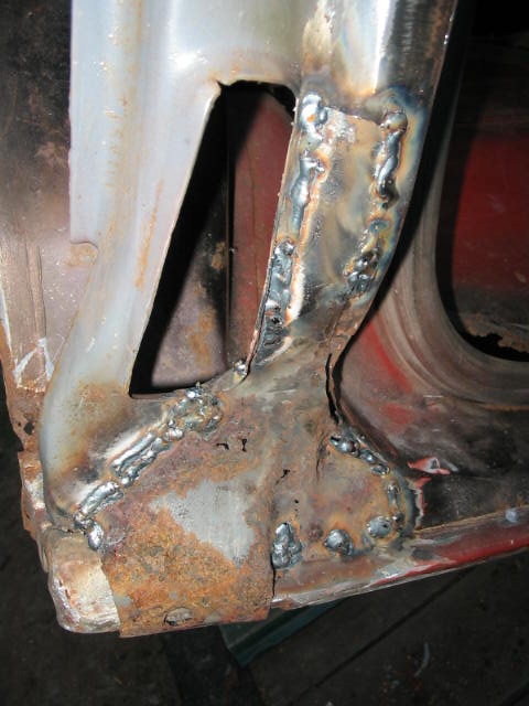 1985 Ford F-350 - This photo shows a section of a vehicle's body that has undergone repair with welding, revealing significant rust damage.