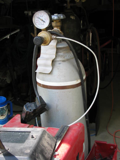 1985 Ford F-350 - A gas cylinder with a pressure gauge and regulator is visible, along with a power cord.