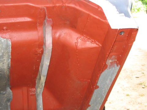 1985 Ford F-350 - Detail of a painted metal section, possibly part of a vehicle frame or body.