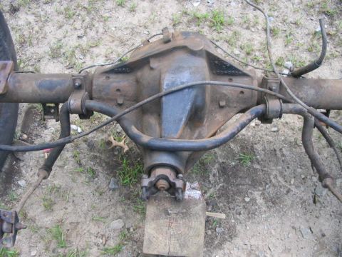 1985 Ford F-350 - Rear axle assembly, likely from a truck, shown outdoors on the ground.