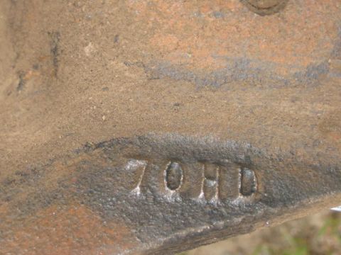1985 Ford F-350 - A close-up view of a metal component bearing the stamped letters '70HD'.