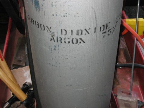 1985 Ford F-350 - A gas cylinder, likely for welding, is shown with text indicating its contents.