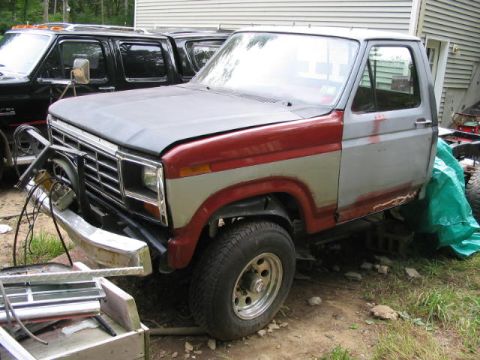 1985 Ford F-350 - This pickup truck, possibly from the early 1980s, appears to be undergoing repairs or restoration.